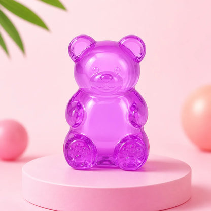 Fioletowy przezroczysty gniotek squishy w kształcie żelowego misia na różowym podeście